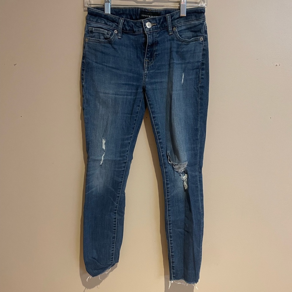 Lucky brand jeans with frayed bottoms